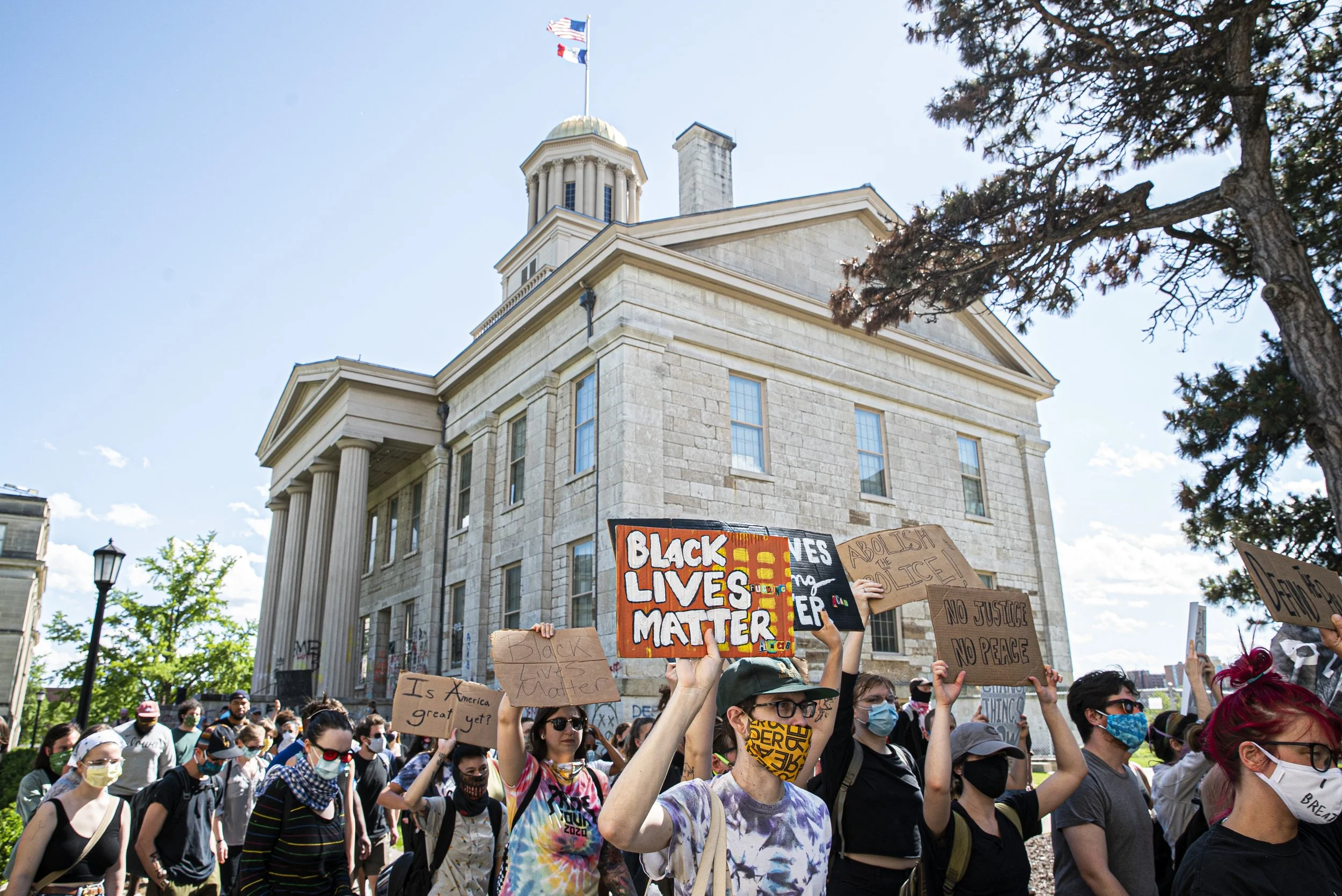  Iowa Citizens march past the Old Capitol as part of a protest on Thursday, June 11th, 2020. Iowa City, along with several major cities across the country, has been a center for protesting racism in the police force and the murder of George Floyd. (T