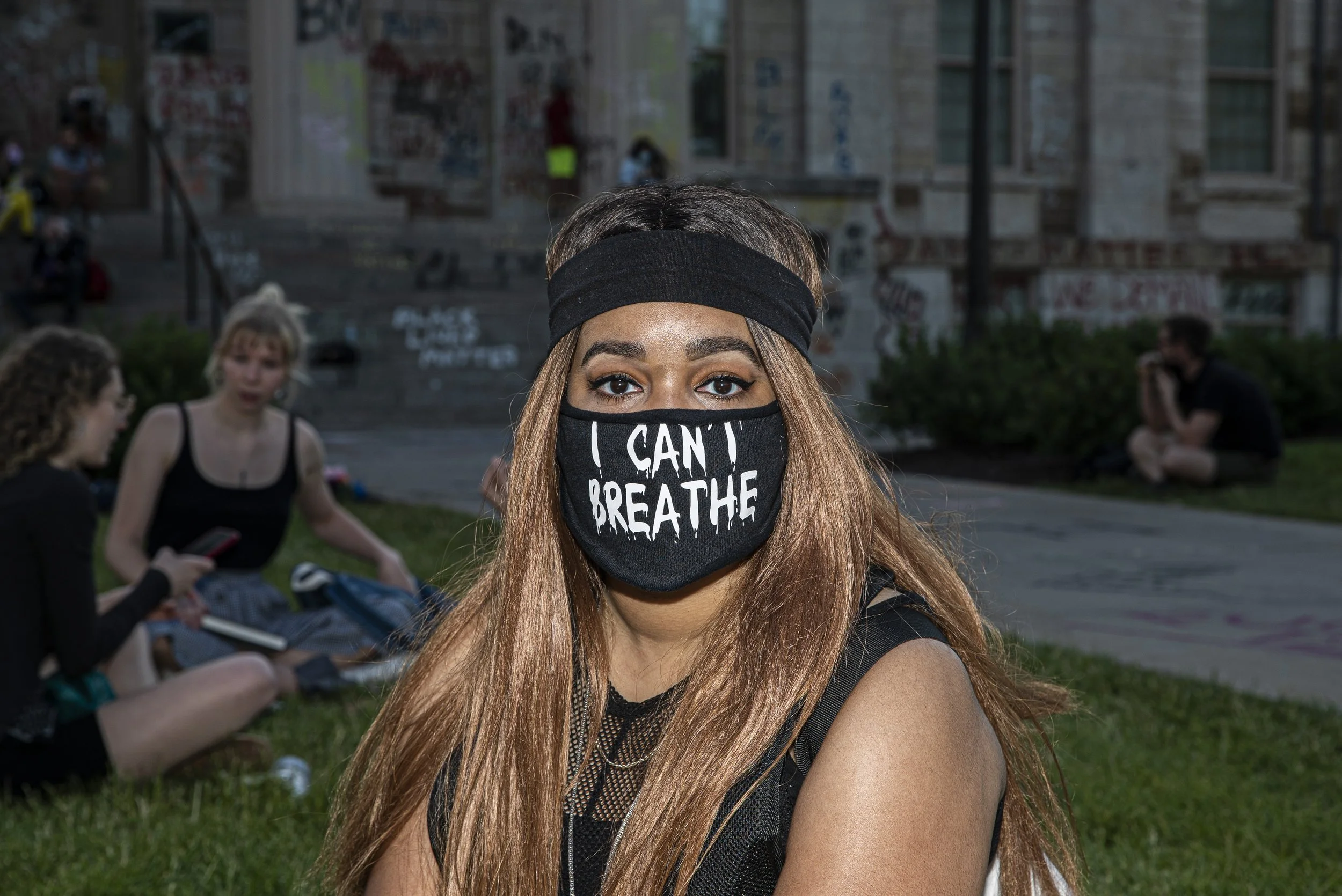 An anonymous Iowa City citizen poses for a portrait in front of the Old Capitol Building while waiting for the next march to start on Sunday, June 14th, 2020. Iowa City, along with several; other major cities across the country has spent the past fe