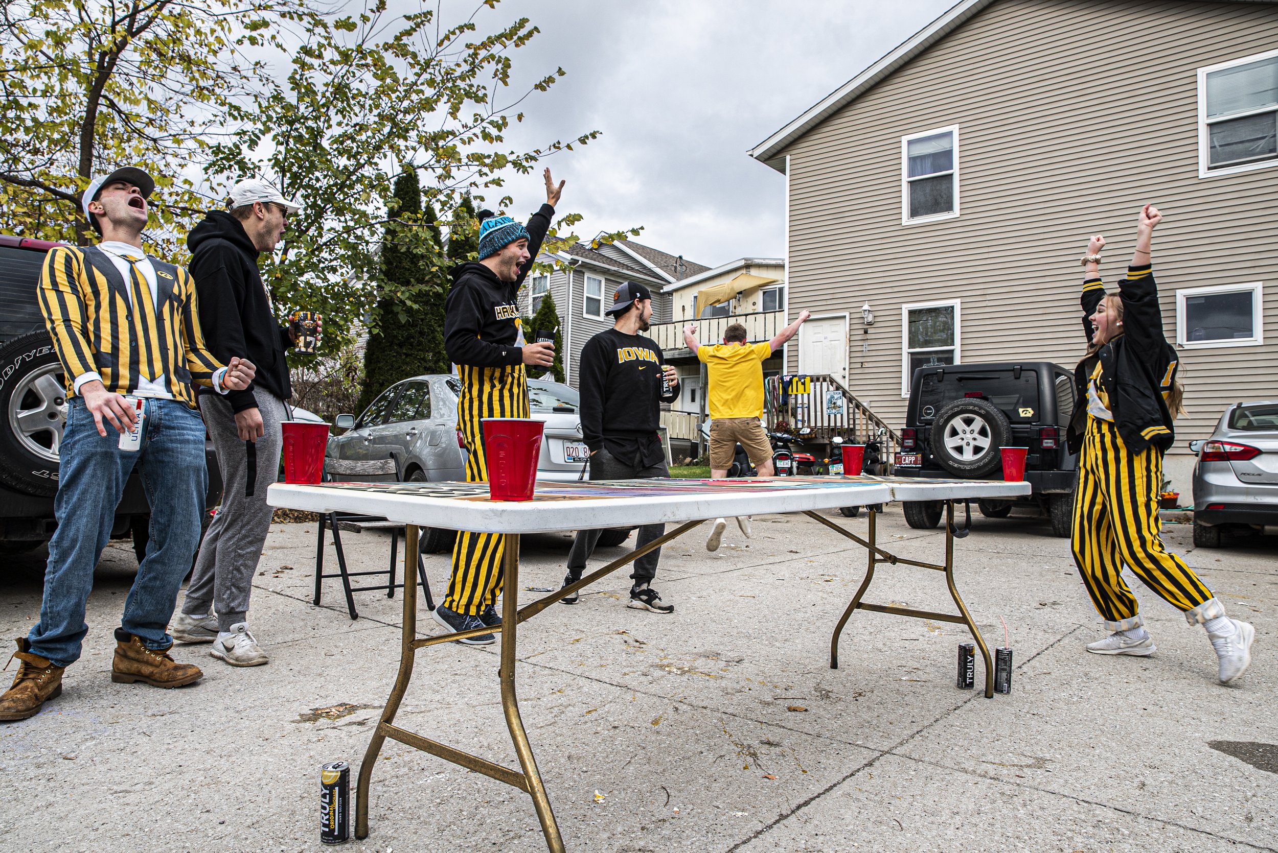  A group of University of Iowa seniors play a game of dye outside while tailgating on Saturday, October 24th, 2020. Despite it being an away game, a handful of Iowa City residents still decided to celebrate with their own, small scale tailgates. “Yea