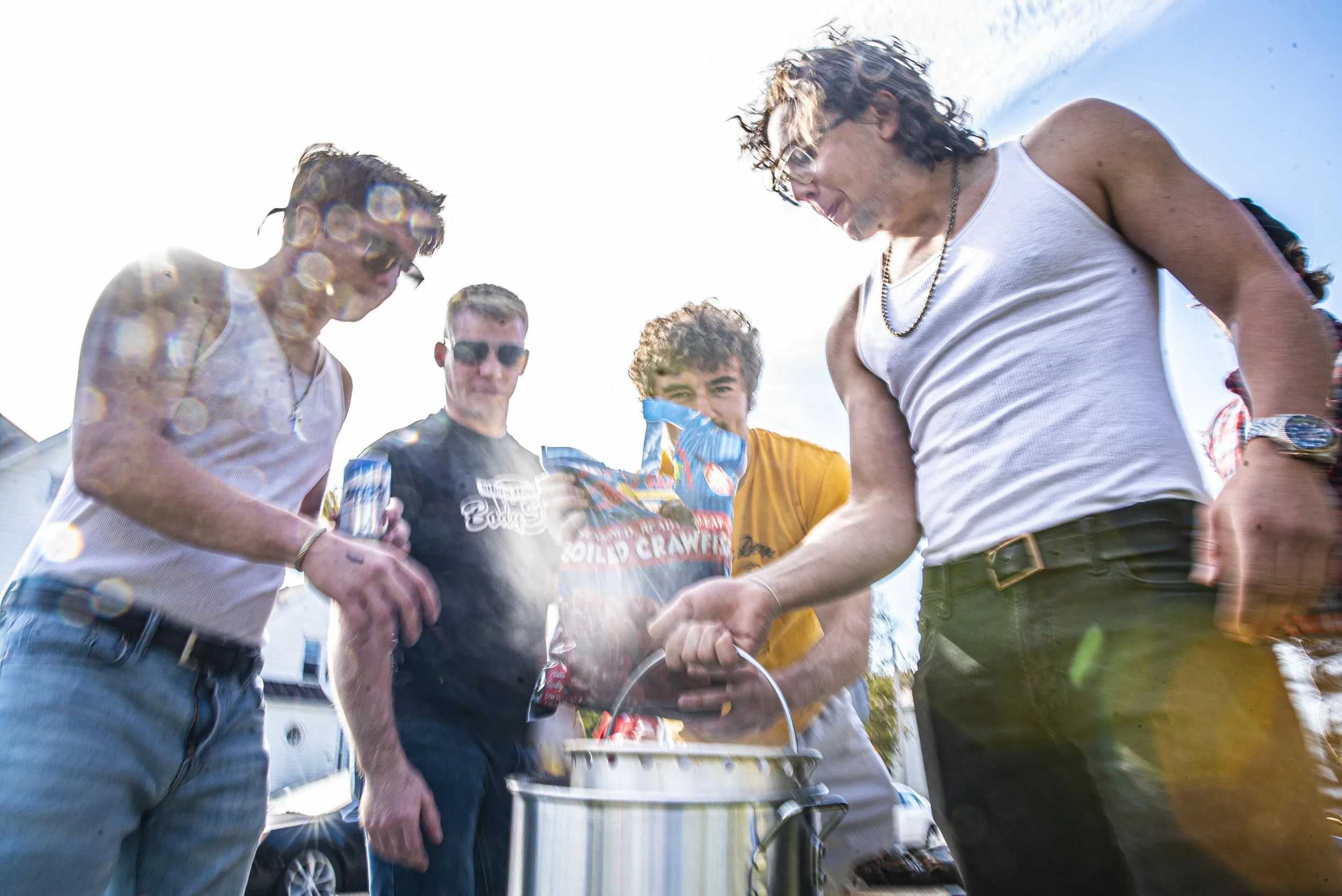  A group of University of Iowa students prepare a pot of crawfish at a home tailgate in Iowa City on Saturday, October 31st, 2020. Despite it being a home, football game and Halloween weekend, local activity is much lower than in recent years. (Tate 