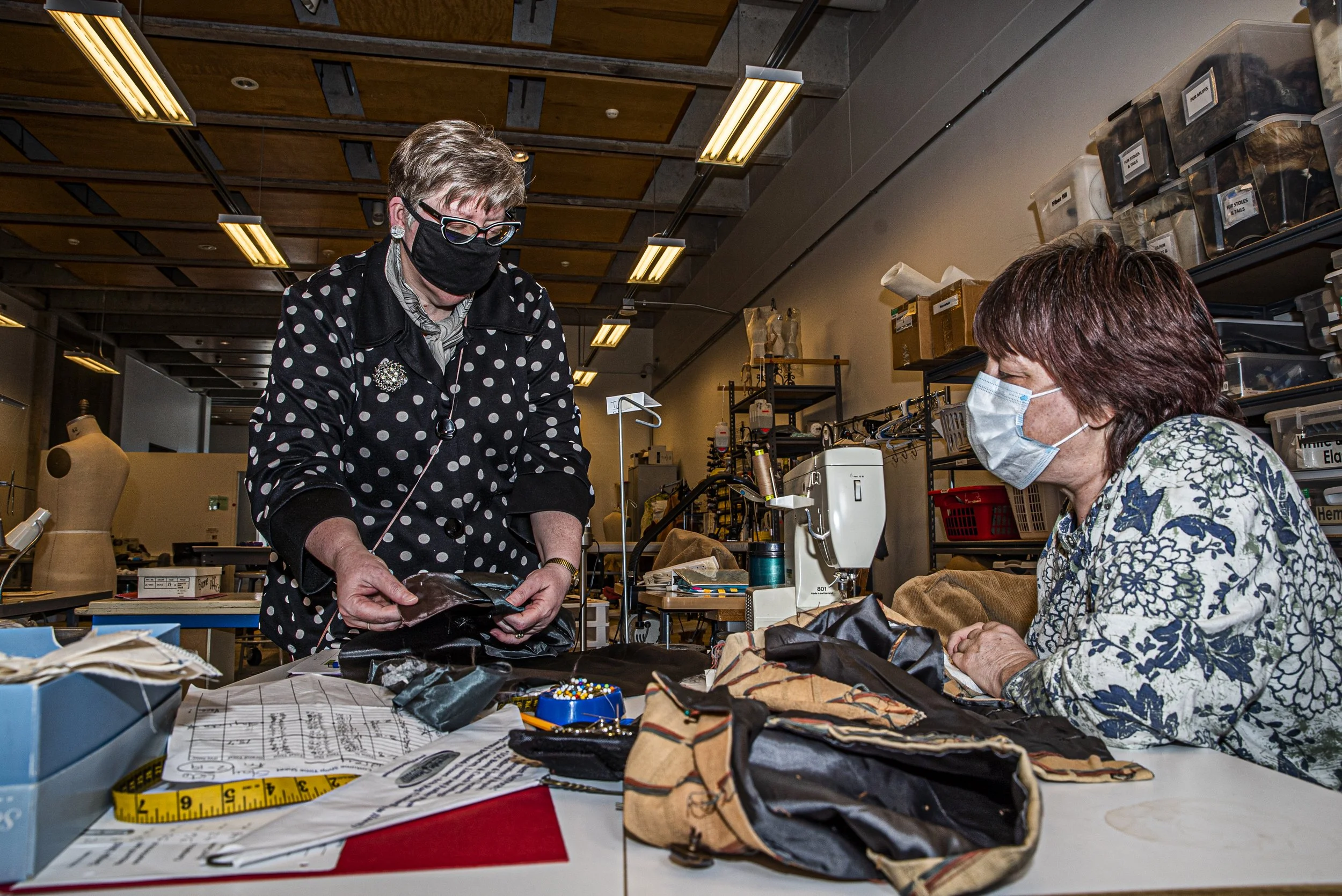  University of Iowa Costume Shop Supervisor Megan Petkewec helps Costume Assistant Audrey Eastin in the University of Iowa Costume Shop in the Old Museum of Art on Thursday, February 25th, 2021. Due to pandemic regulations, before the Park will be st