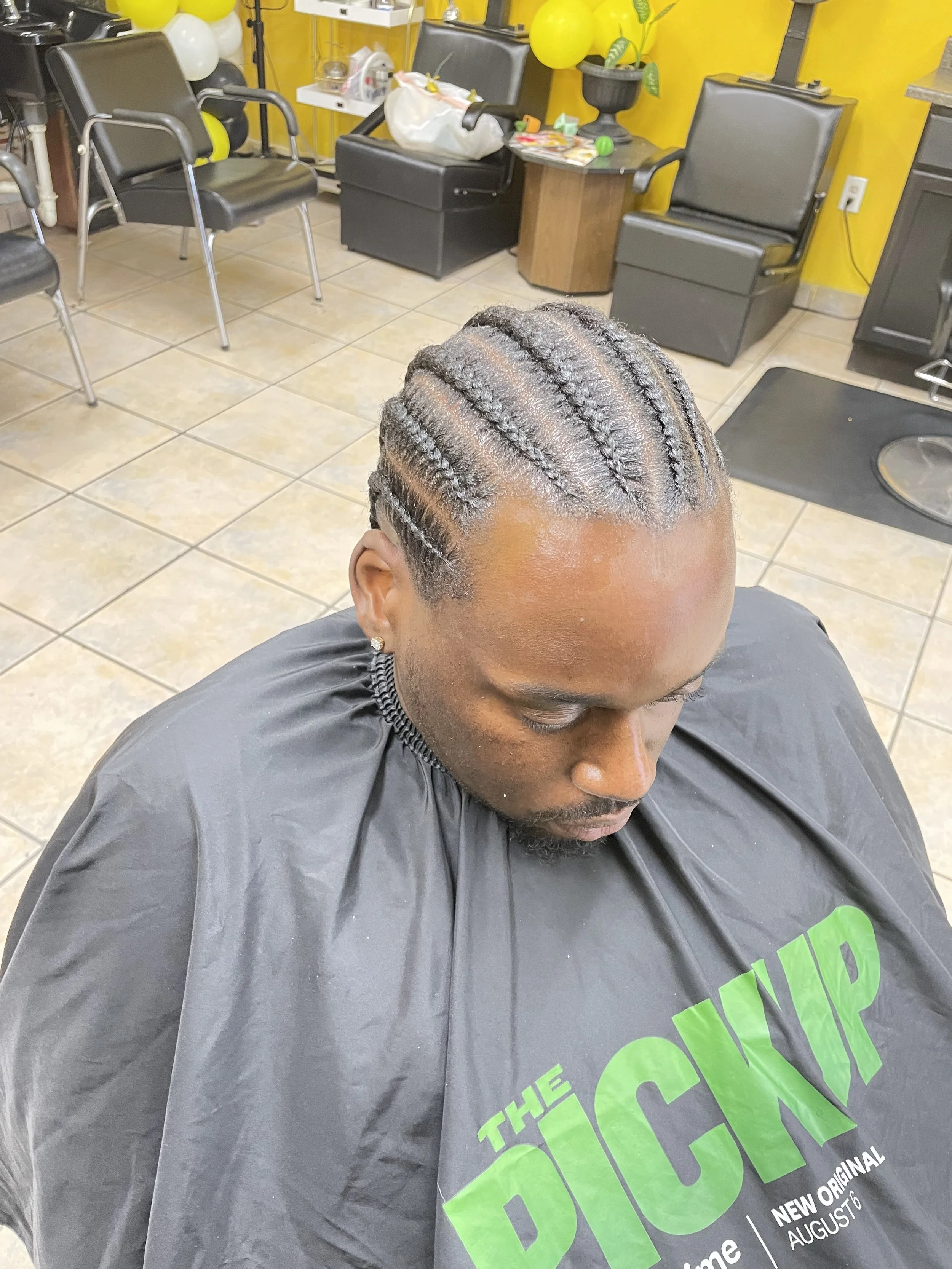 Geometric drawing of an outline square with sections divided by vertical, horizontal, and diagonal lines.