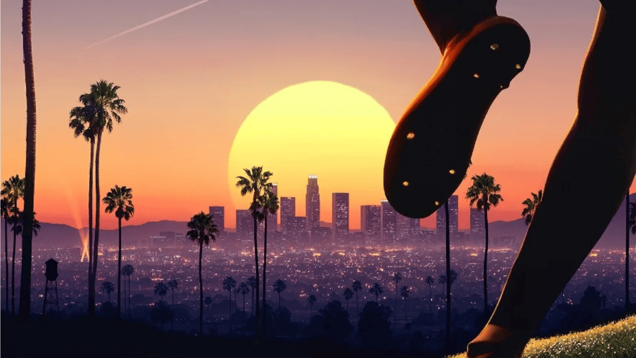 Skyline of Los Angeles with a setting sun in the background and the feet of a soccer player in the foreground