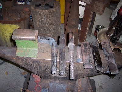 Mandrels, eye drifts, and small railroad track anvil used to create the axes
