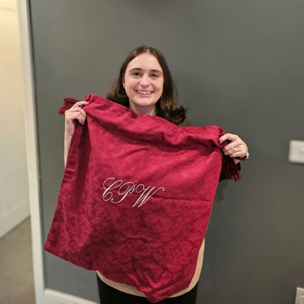 Stephen Wood KC Presents Clare Walsh with a Red Bag