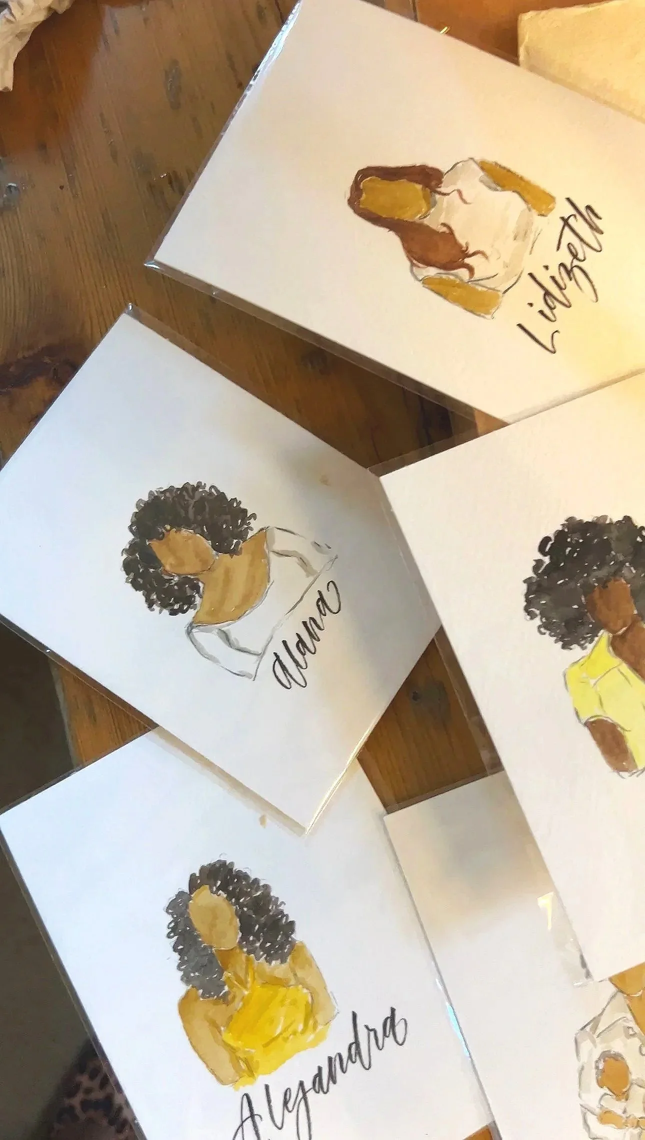 Melarie Odelusi painting artwork with earth tones on canvas at a Peloton in-store Black History Month brand activation. 