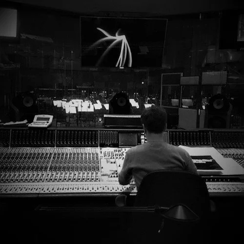 Mick Morrison, Mixing and Mastering Engineer, sat at mixing desk