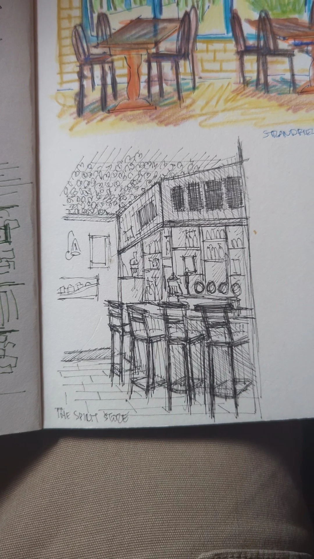 Sketch of a bar with high chairs, shelves with bottles, and decorative items on the wall.