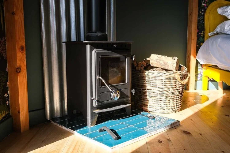 The-toasty-woodburner-inside-Bramble-cabin-at-Wye-Glamping-in-Wales-for-couples.jpg