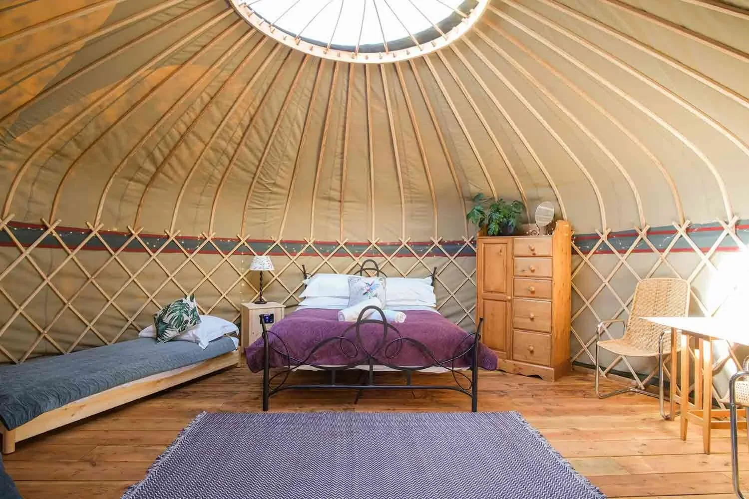 Inside-a-canvas-yurt-at-Wye-Glamping-in-Wales.webp