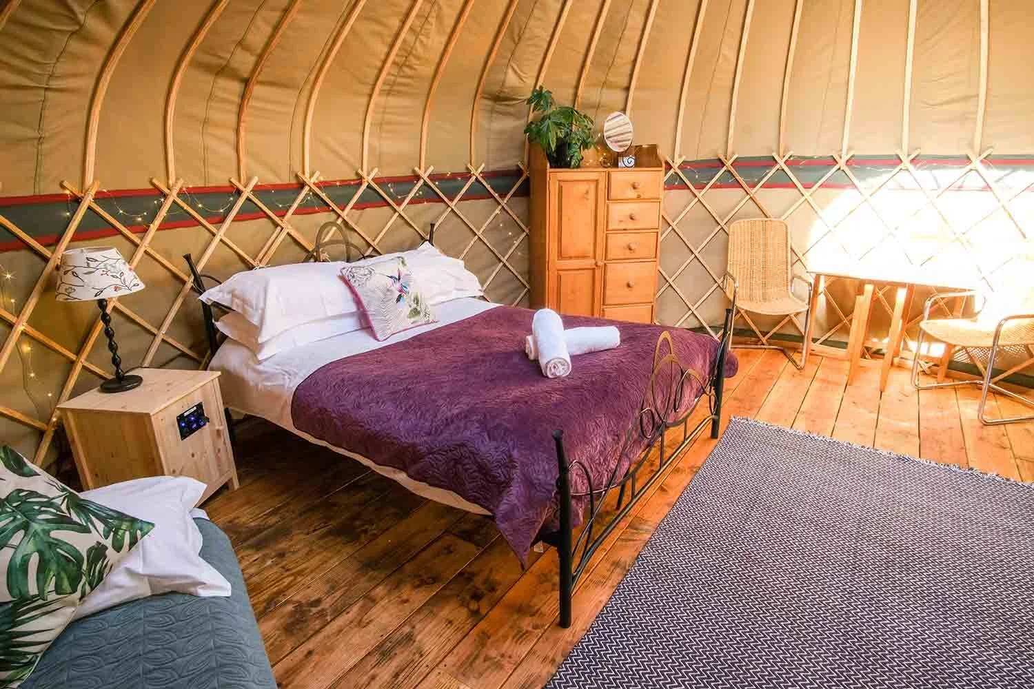 Inside-one-of-the-canvas-yurts-at-Wye-Glamping-in-Wales.webp