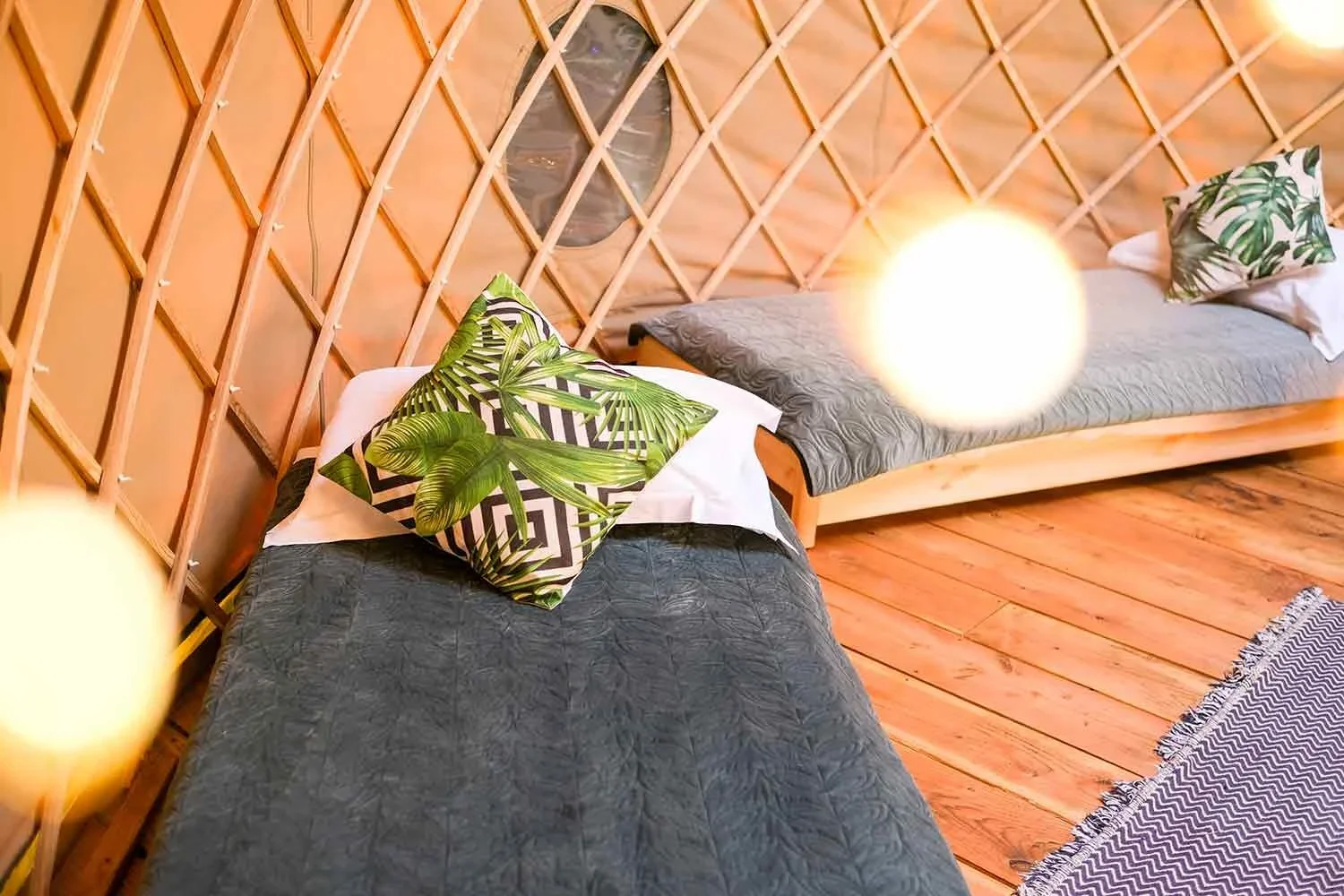 Single-beds-in-the-canvas-yurts-at-Wye-Glamping.webp