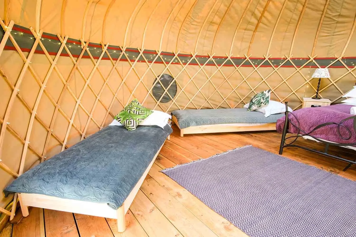 Single-beds-in-Barley-canvas-yurt-at-Wye-Glamping.webp