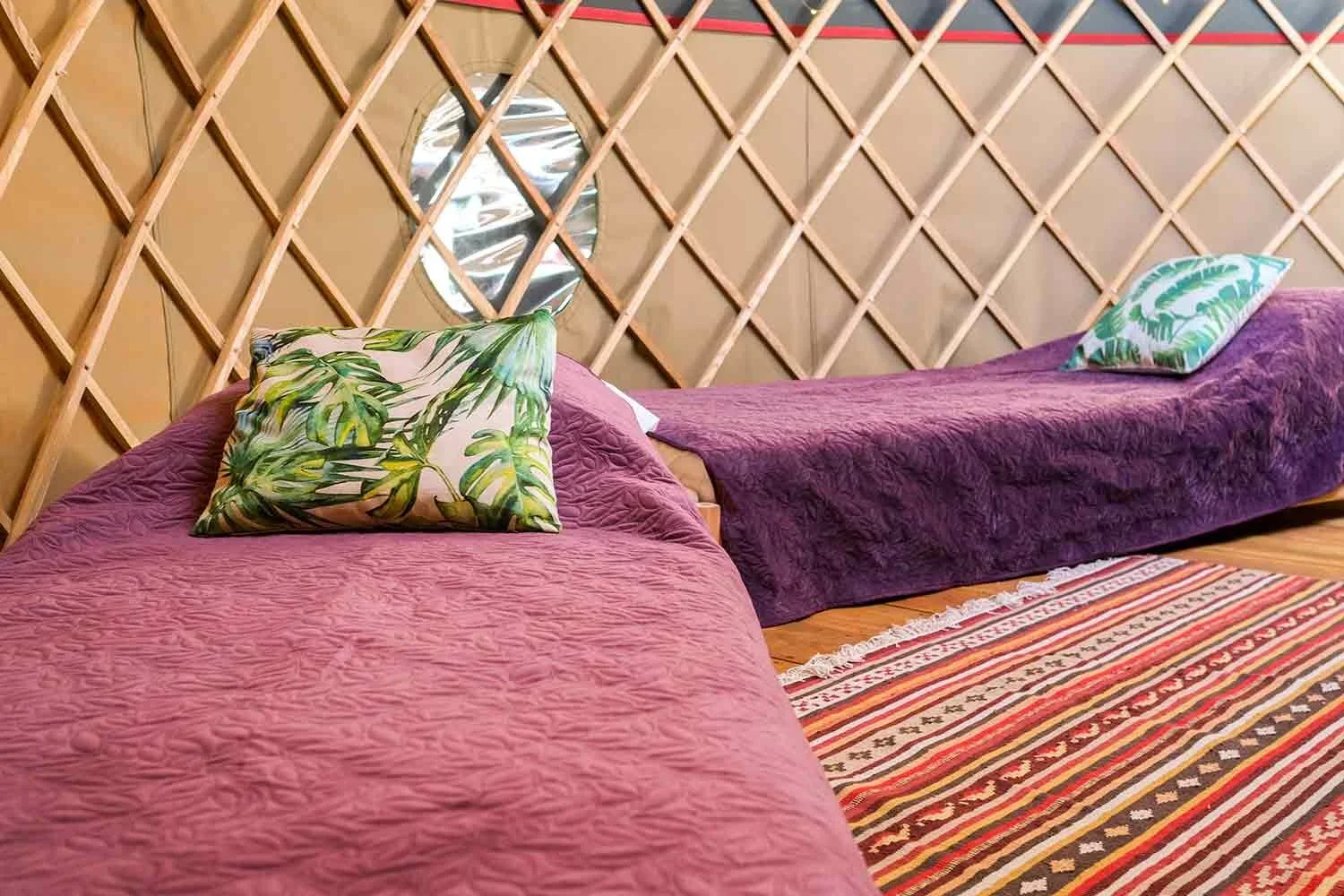 Each-canvas-yurt-at-Wye-Glamping-has-a-king-size-bed-and-two-singles.webp