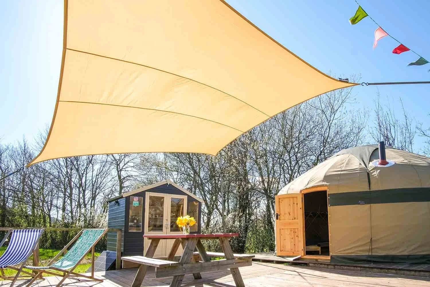 Wye-Glamping-canvas-yurts-have-their-own-large-sundeck.webp