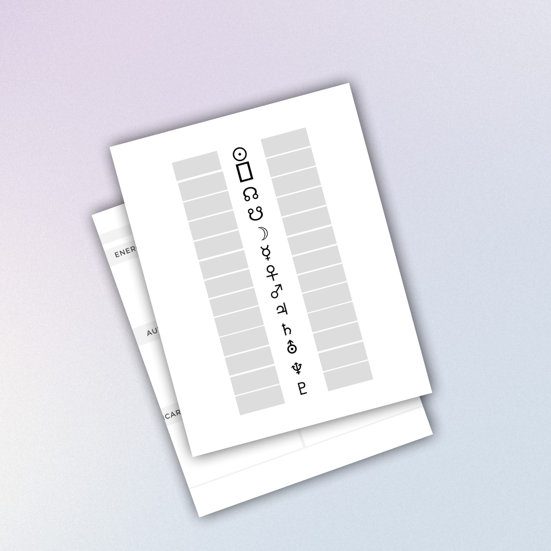 A paper with symbols and empty boxes, likely a form or chart, placed on another sheet of paper.