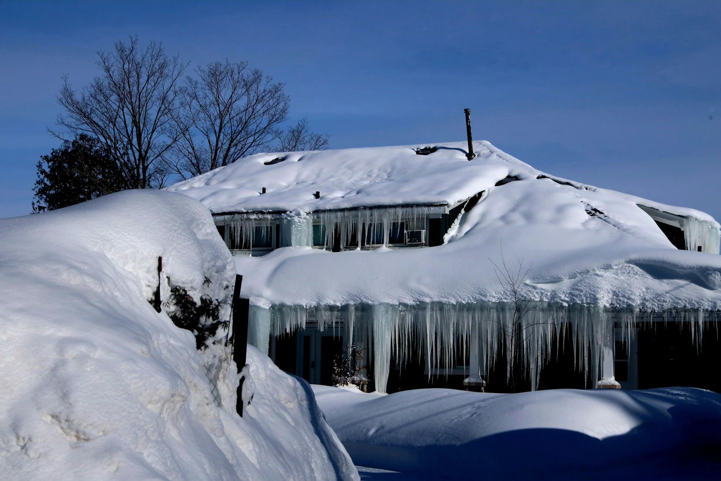 Roof Ventilation &amp; Insulation in Michigan: Preventing Ice Dams