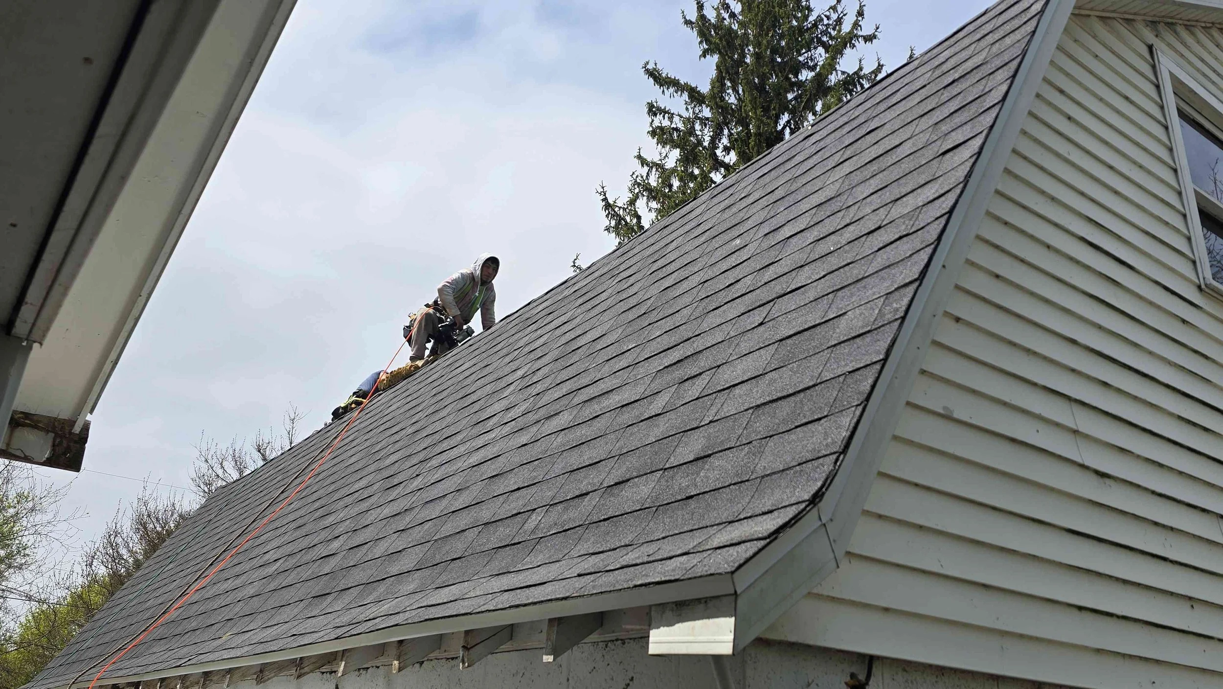 Man on top of a roof working