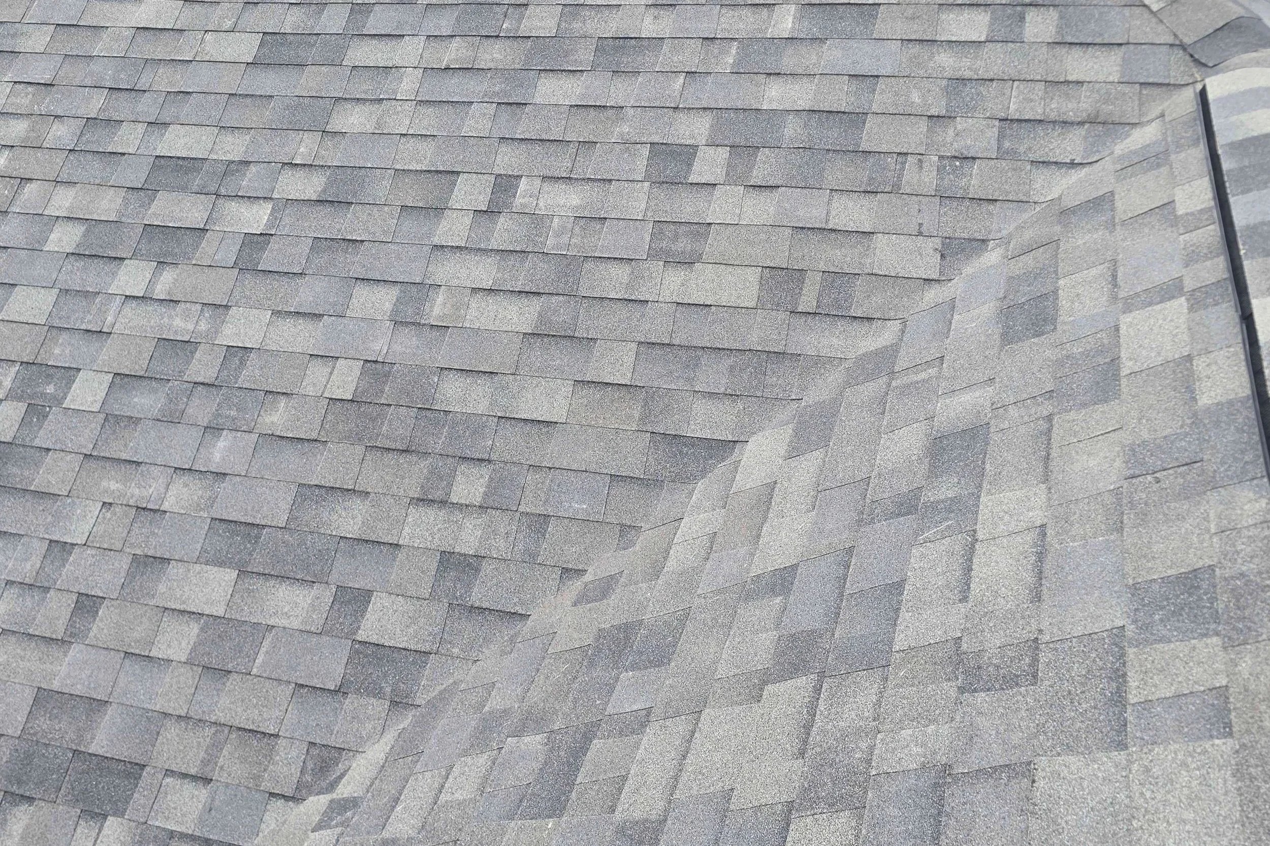 Newly redone roof with grey shingles