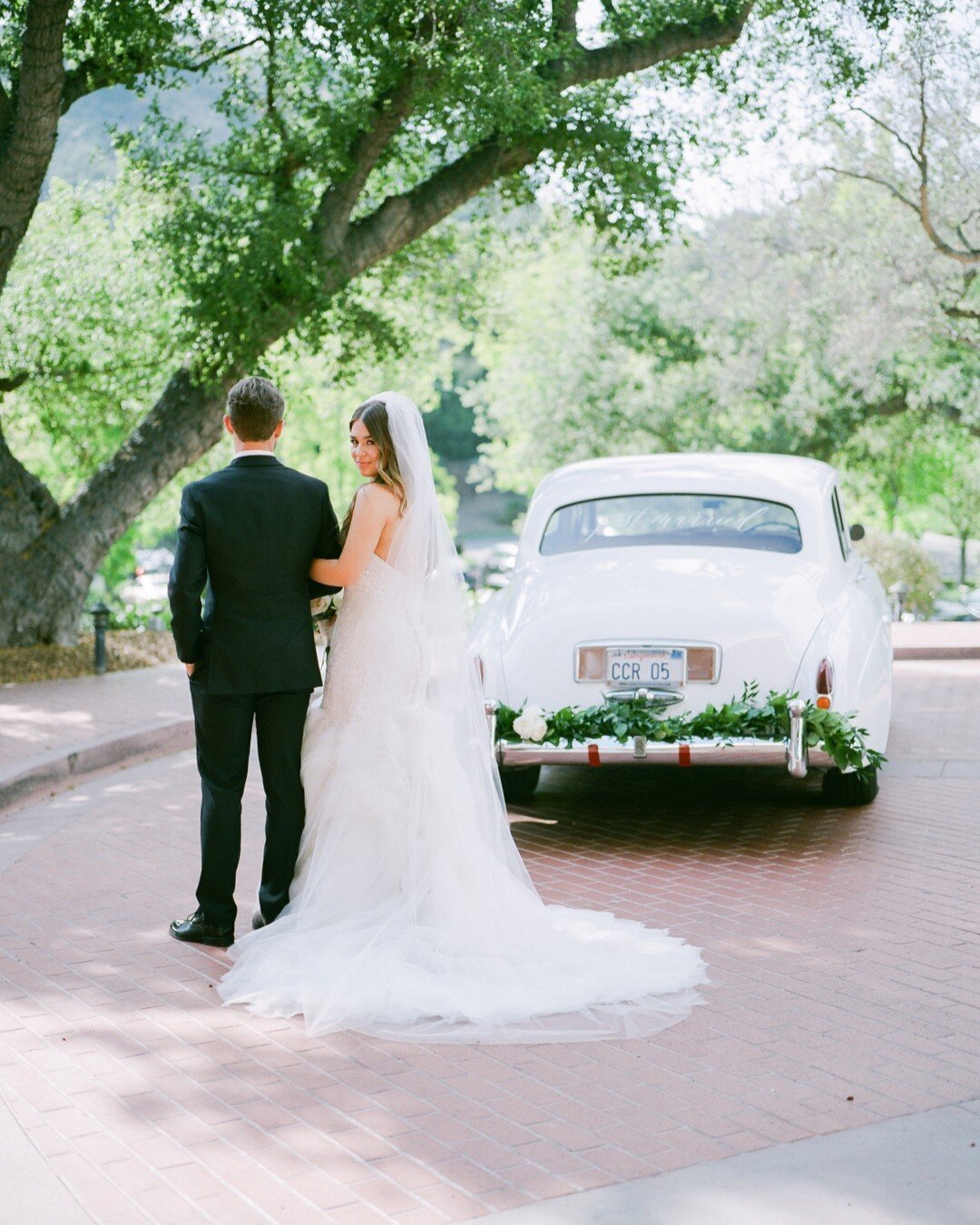 Riding off into a lifetime of love 🚗🤍​​​​​​​​​.
.
Wedding Planner &amp; Designer: @trinaschmidtweddings
Photography: @lucasrossiphoto
Venue: @sherwood_country_club
Floral design: @uniquefloraldesigns⠀