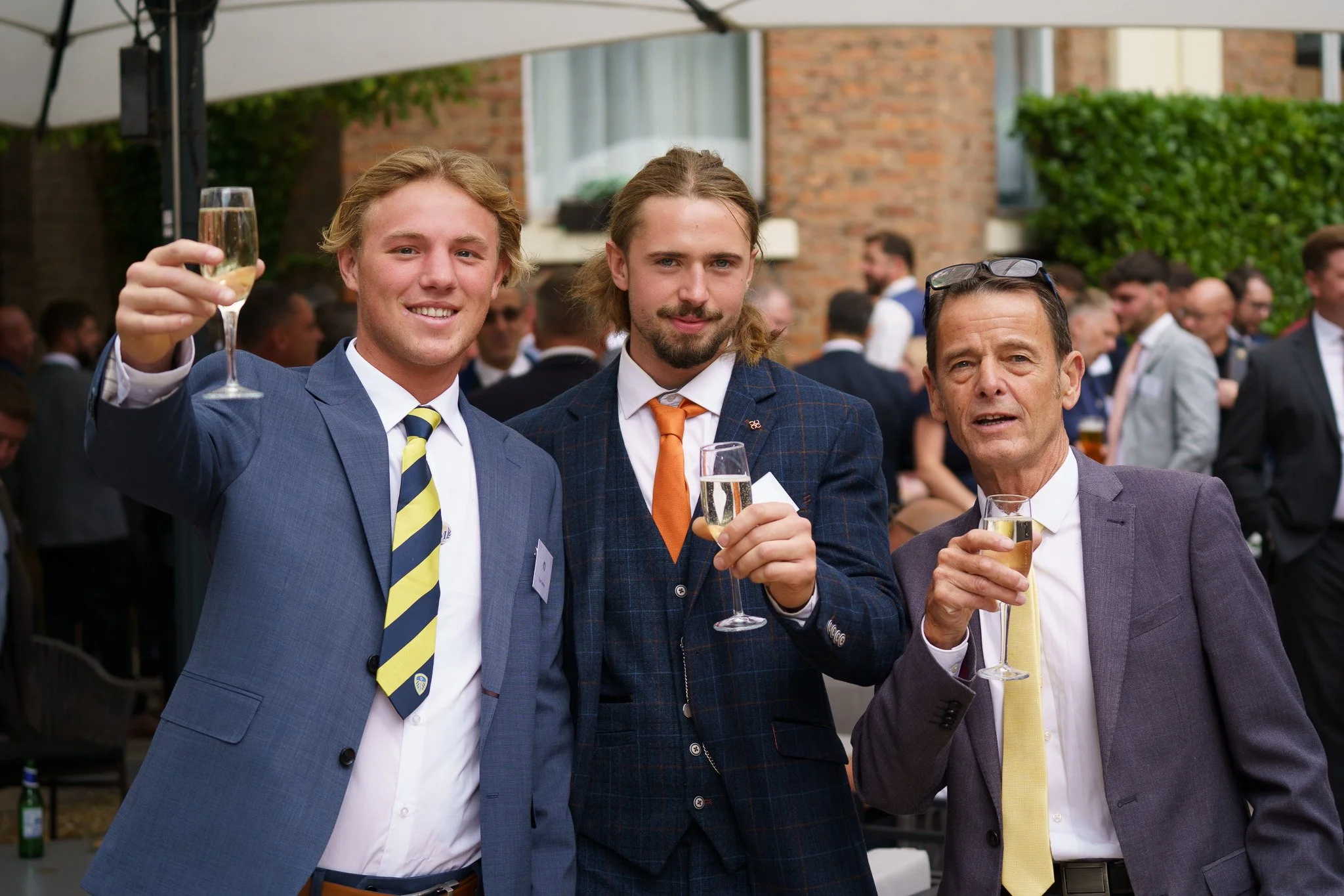 men raising a toast at awards event in Chester