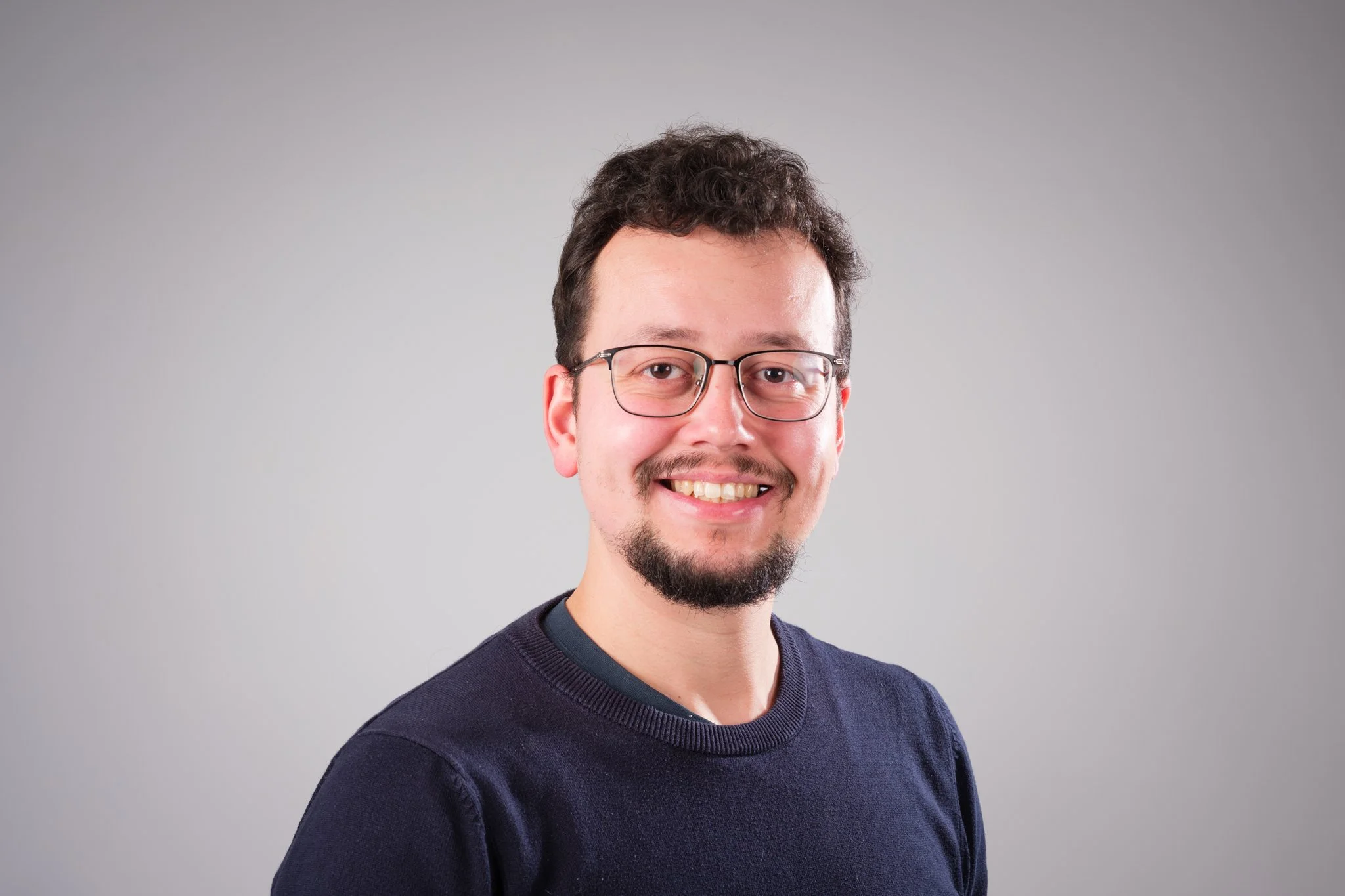 Studio workplace portrait of man at wrexham university