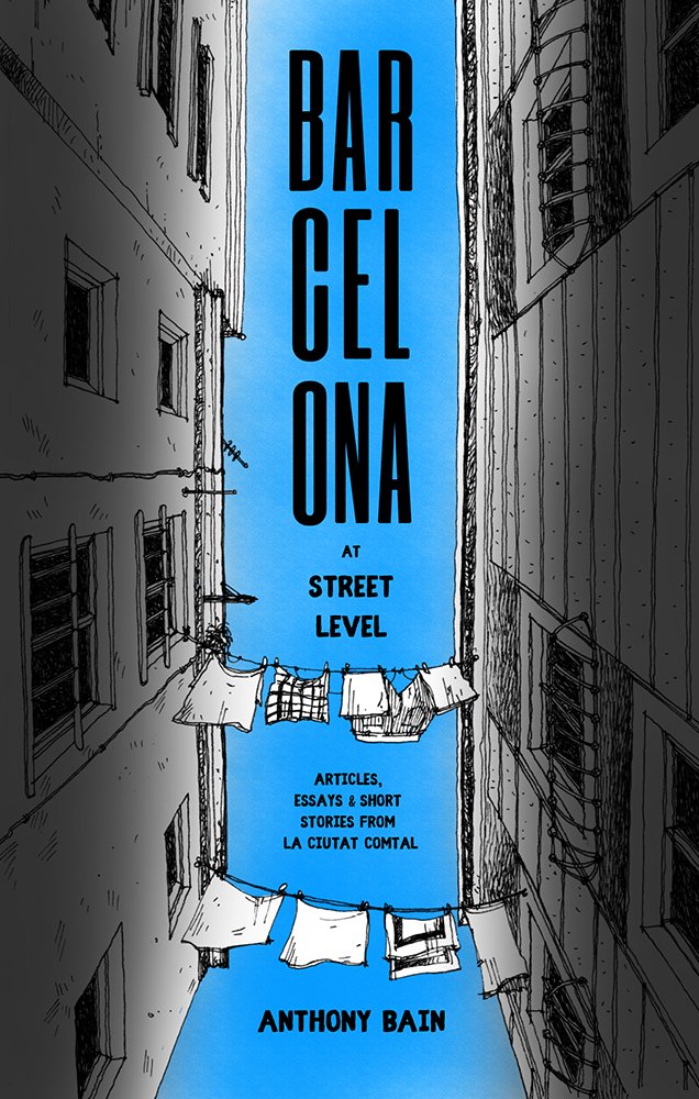 Book cover titled 'Barcelona at Street Level' by Anthony Bain features an illustration of a narrow city alley with tall buildings on either side, laundry hanging on a clothesline in the foreground, and a bright blue sky above.
