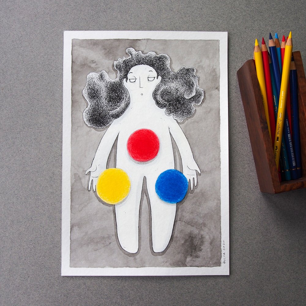 A drawing of a person with black, curly hair and minimal facial features, with red, yellow, and blue circles on their torso and groin area, on a gray background, with colored pencils in a wooden holder to the right.