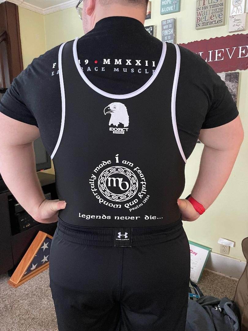 Seth had his dad's logo added to his singlet for his competition for inspiration.