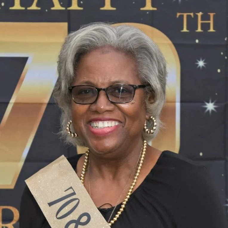 smiling woman dressed in black
