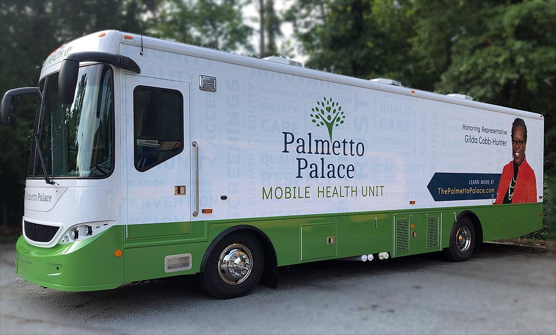 A large bus that says "mobile health unit" on the side