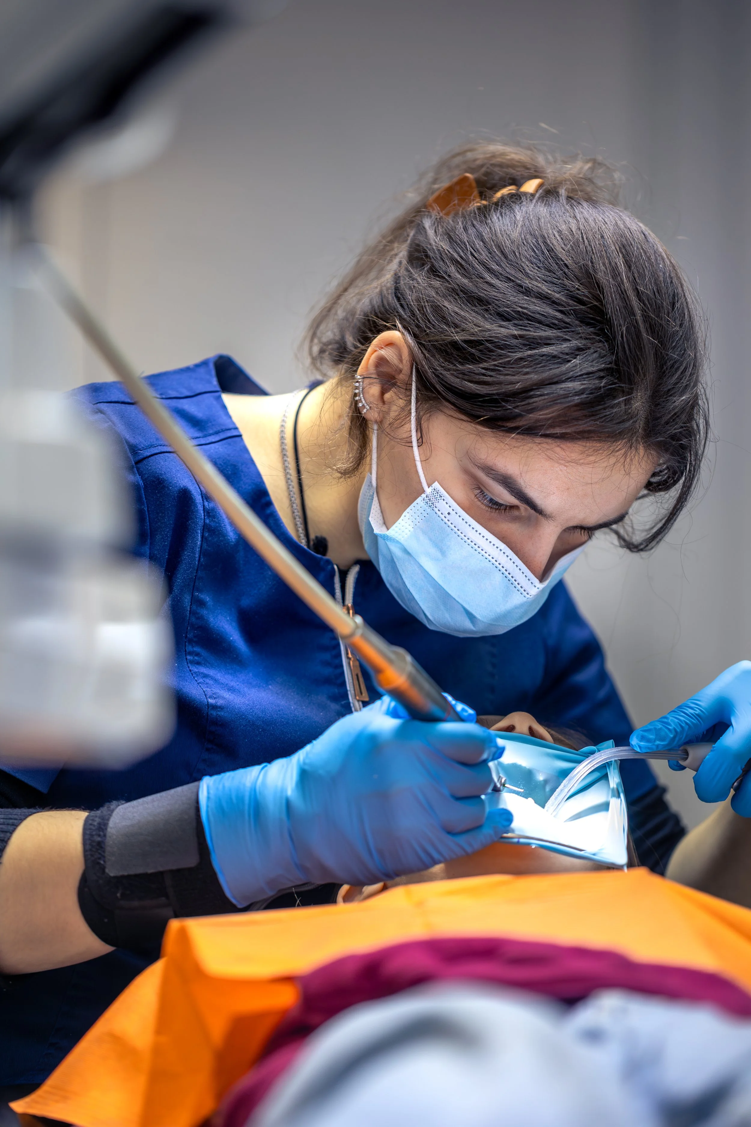 A dentist treats a patient