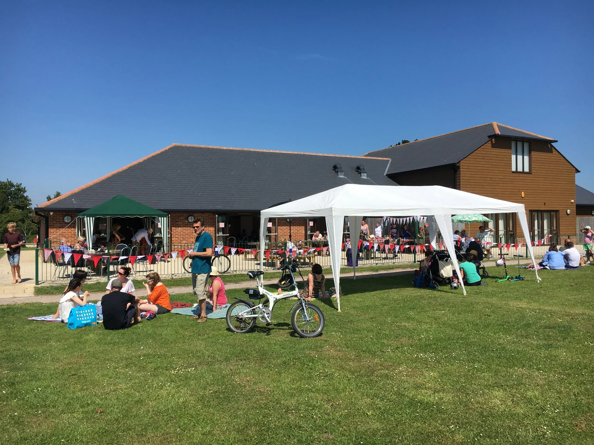 community get together so hot this day but we all came out for picinics and live music on the field