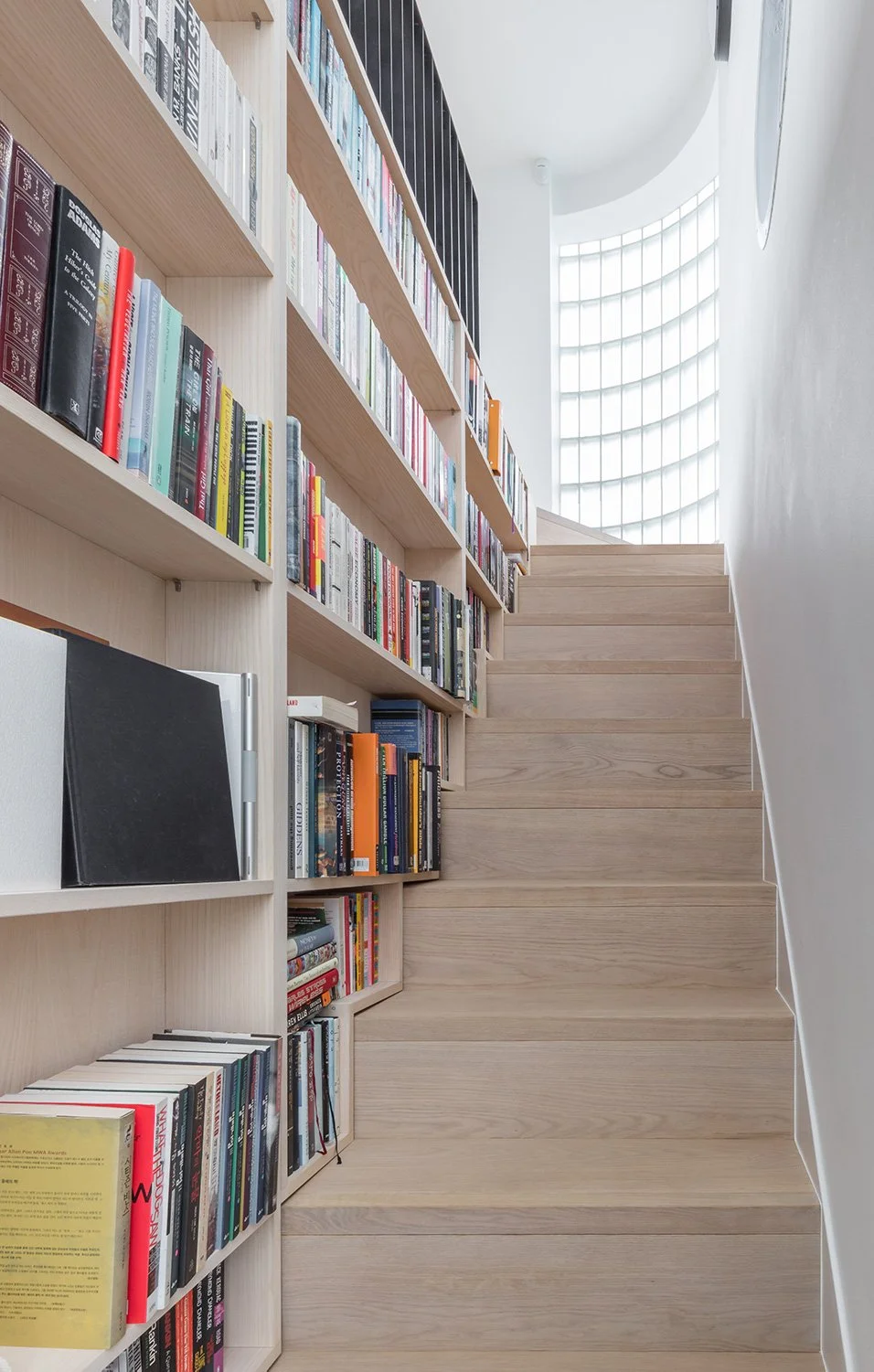 union-wharf-stairway-with-bookcases-and-curved-window.jpg