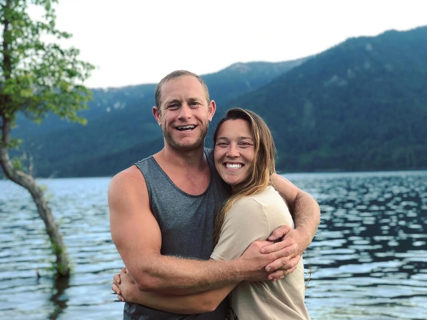 Graham Gribble of Grux Construction hugging his wife.