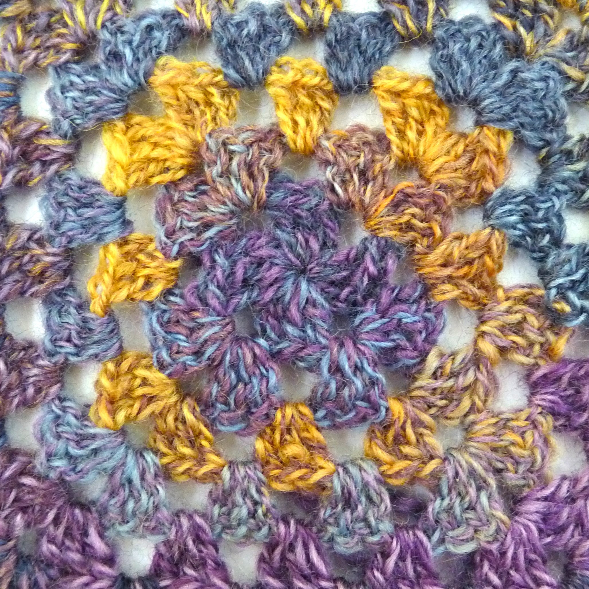 Crocheted granny square with handspun yarn