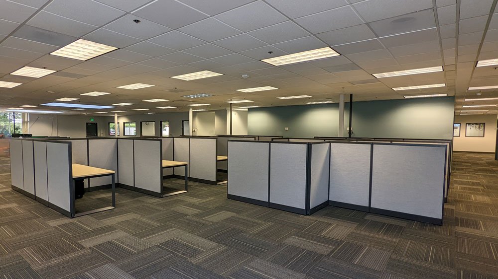 Refinished Steelcase Avenir cubicle panels with stationary desks, metal O-Legs, and mobile pedestals