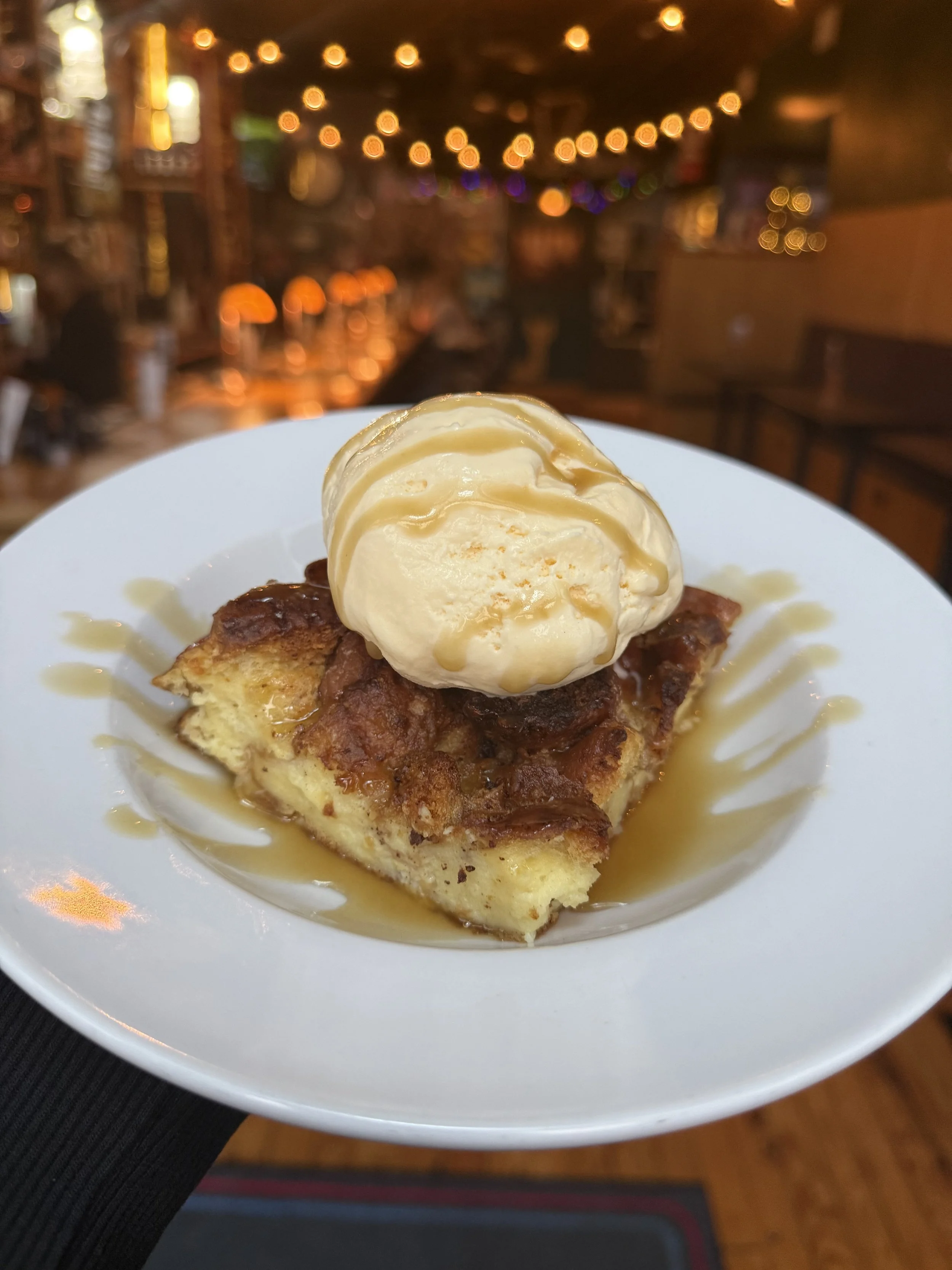 Donut Bread Pudding with ice cream and bourbon glaze