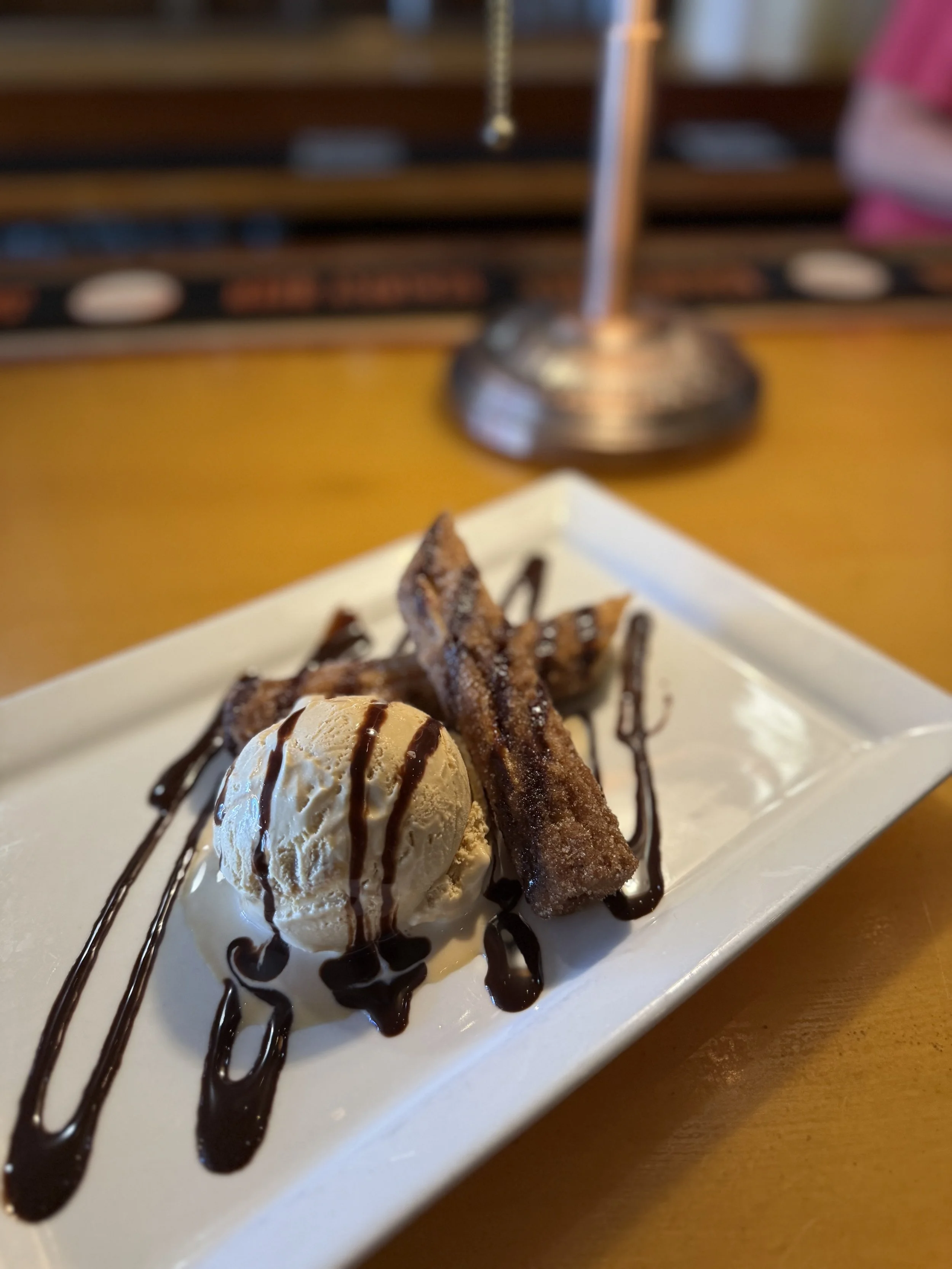 Cinnamon sugar churros with sea salt caramel ice cream and a chocolate drizzle