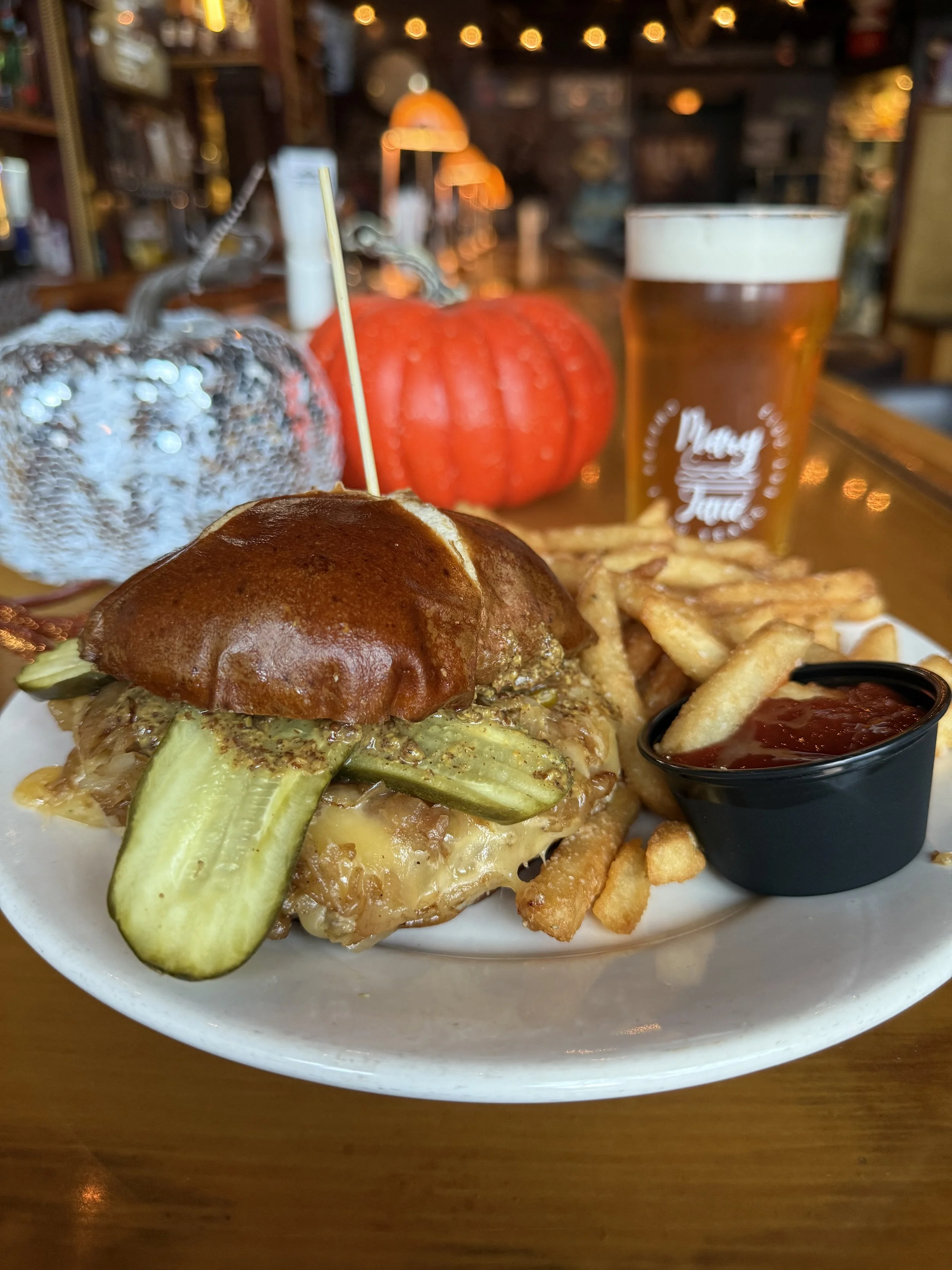 brat burger. gouda cheese, sauer kraut, pickles, beer mustard, pretzel bun