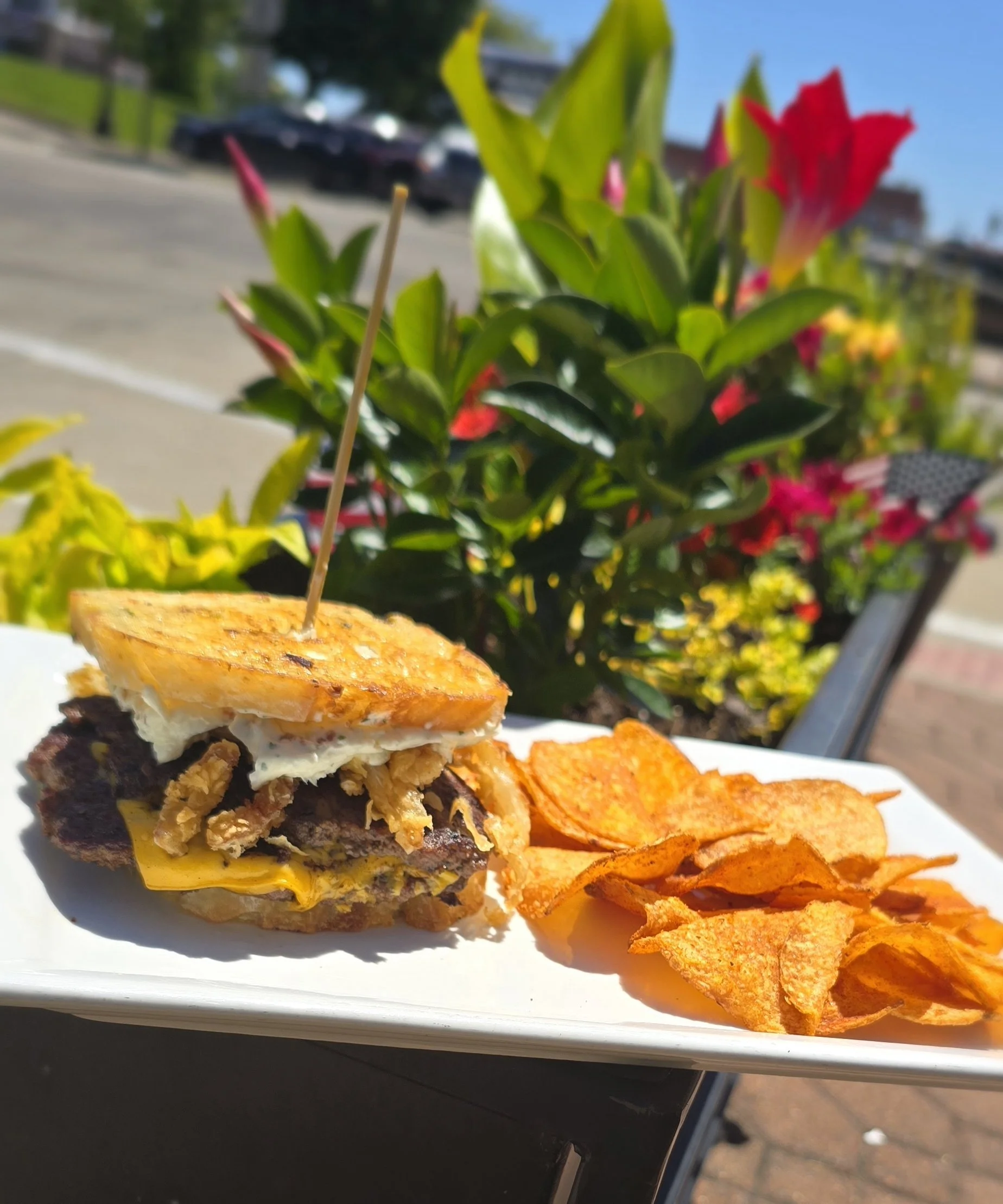 Sourdough, double beef smash patties, American cheese, crispy fried onion straws, bacon pickle cream cheese spread.