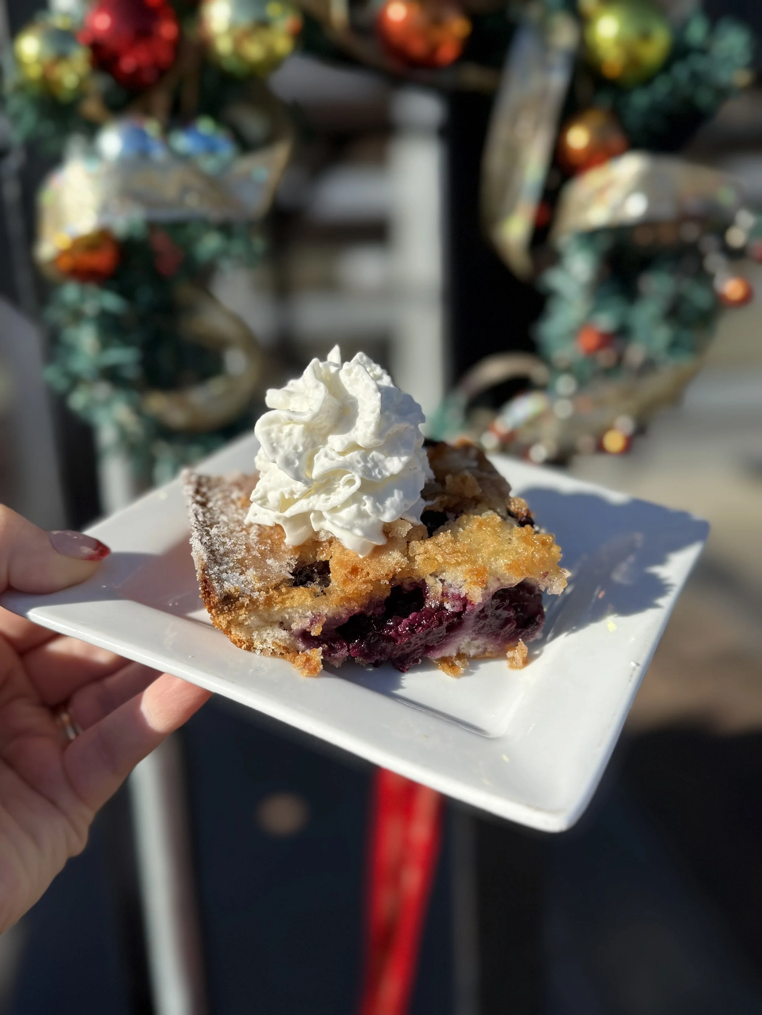 Blackberry Cobbler topped with whipped cream