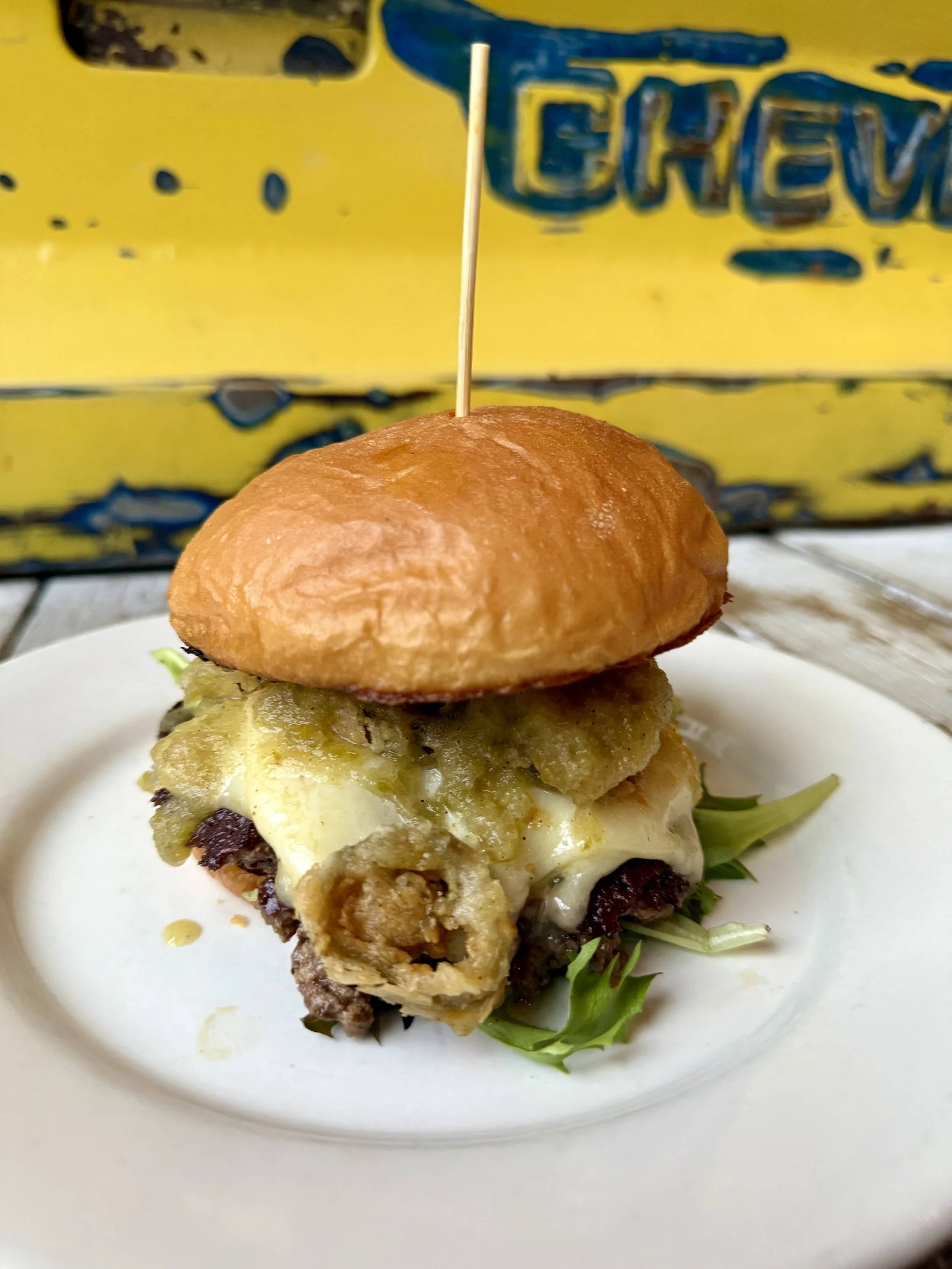 Beef, mixed greens, provel, fried jalapenos, pineapple hot sauce, hawaiian bun