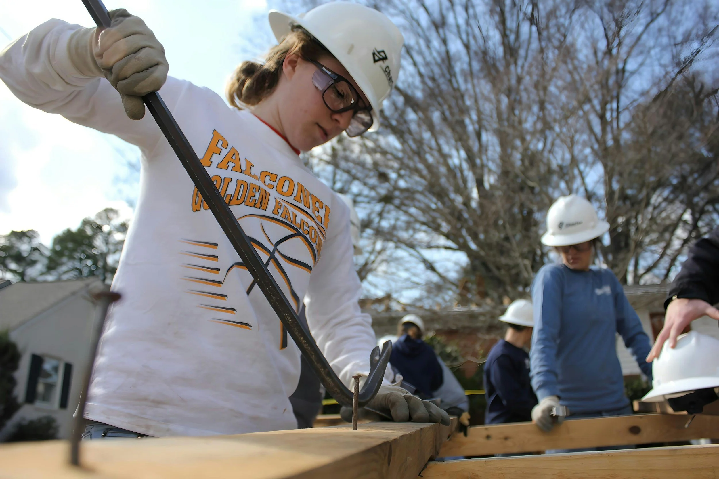 Young woman working on a construction site.