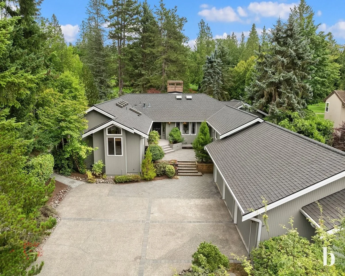 🌟 Welcome to this beautiful rambler located in the prestigious Bear Creek Country Club on the first hole of the golf course! 🌟

This light-filled home features soaring wood ceilings in the spacious family room with gas fireplace, seamlessly flowing