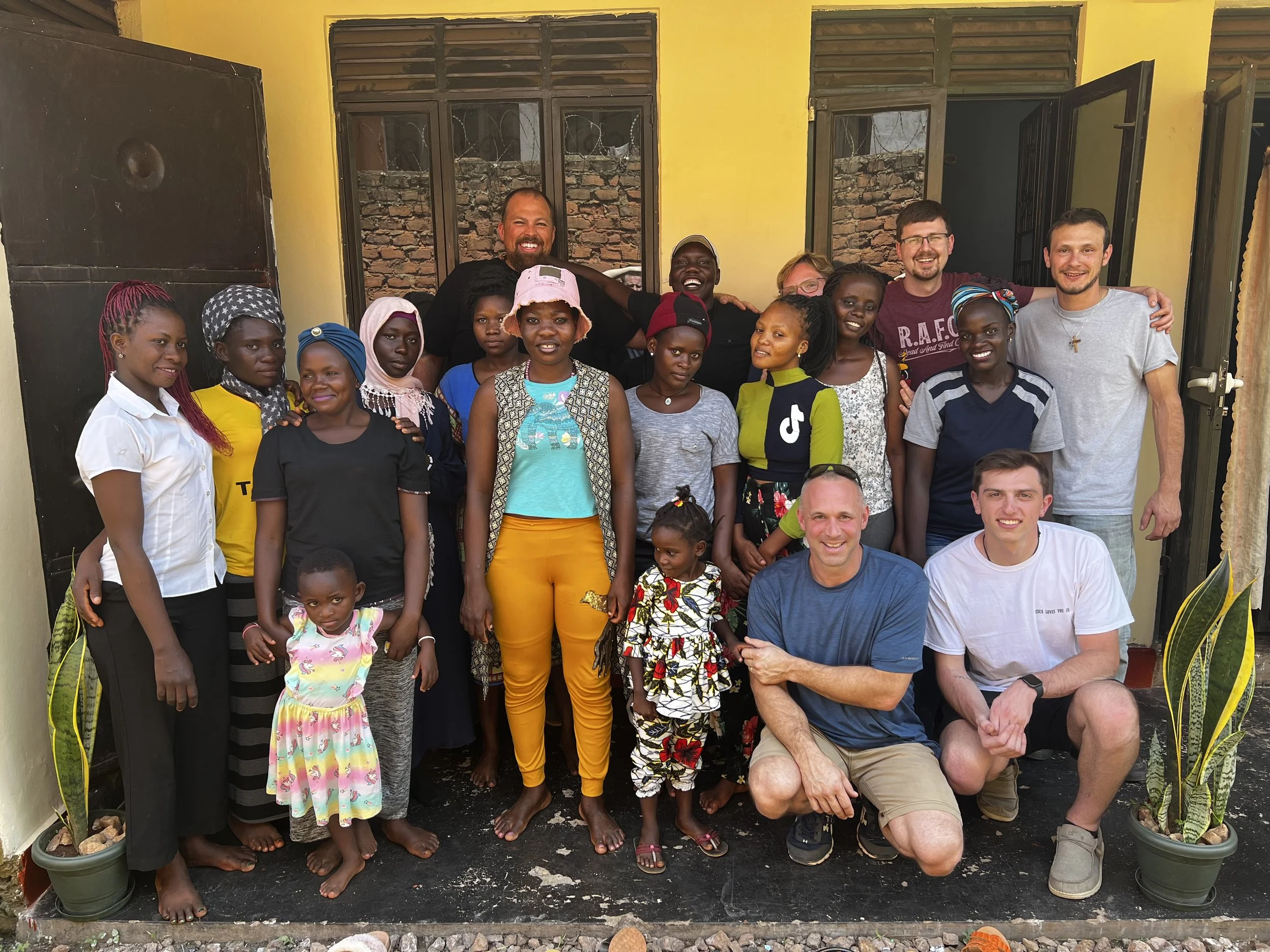 The Ladies Standing in Front of Their Home in Kampala.jpeg