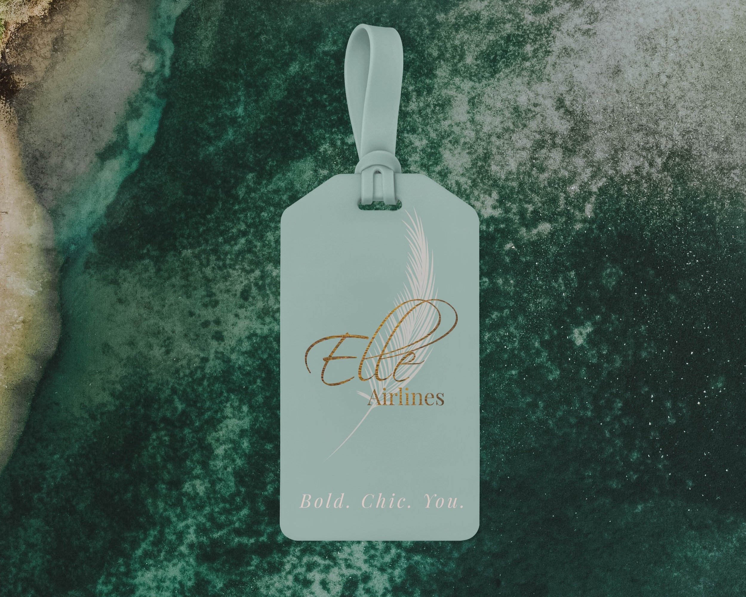 Blue luggage tag with "Elle Airlines" over pink feather and "Bold. Chic. You." at bottom over green background
