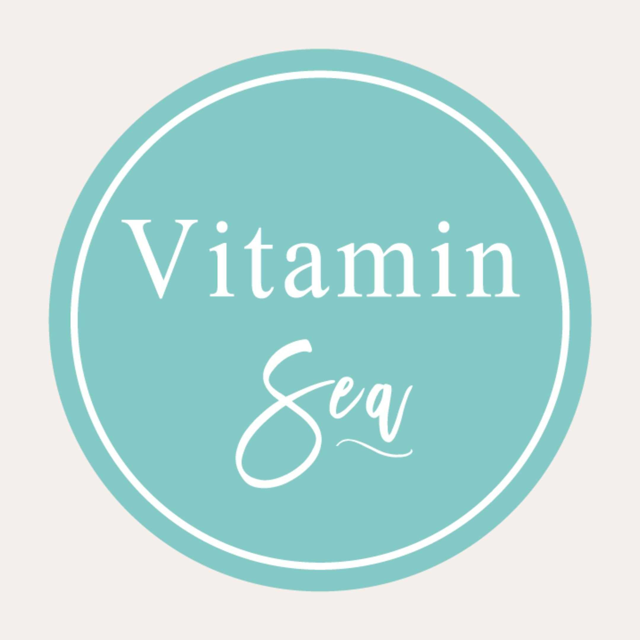 Alternate logo for Vitamin Sea depicts just "Vitamin Sea" in white lettering inside white circular cutout on a light blue circular background