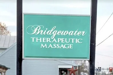 Sign featuring former business name, "Bridgewater Therapeutic Massage" over a light blue background.
