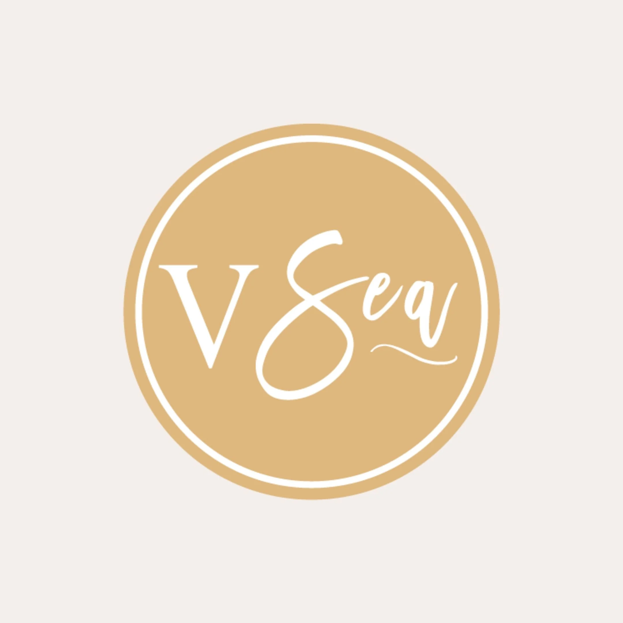Yellow circle with white circle outline inside and white "V Sea" placed inside. "Sea" has a scroll line under "ea."